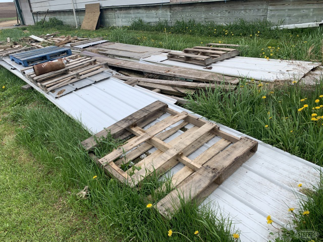 Pallets of used pole barn painted steel  north of parlor